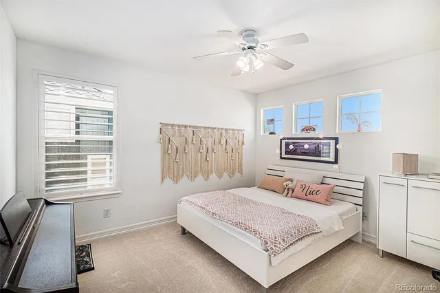 a bedroom with a bed and a night stand