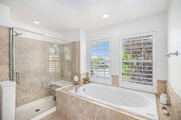 a bathroom with sink bathtub and window