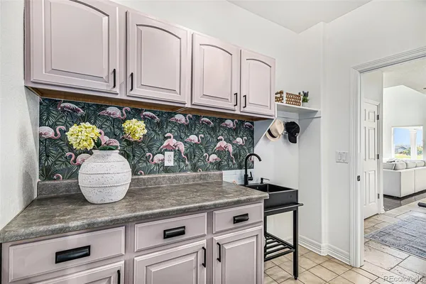 a kitchen with stainless steel appliances granite countertop a sink and cabinets