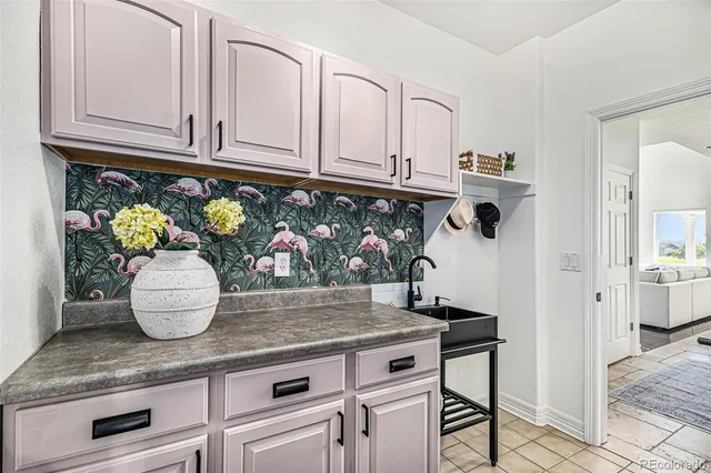 a kitchen with stainless steel appliances granite countertop a sink and cabinets