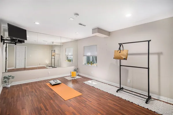 a view of a room with wooden floor