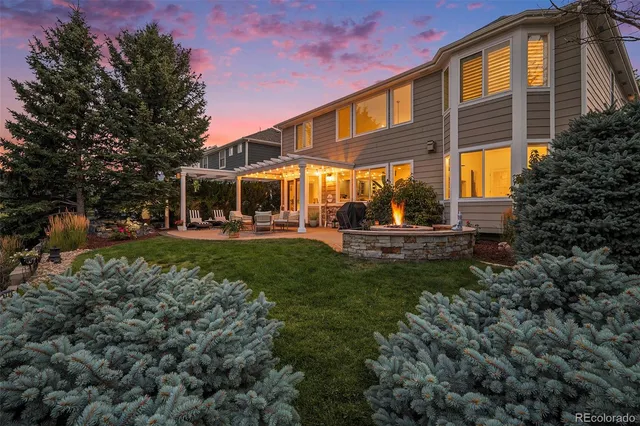 a front view of a building with trees