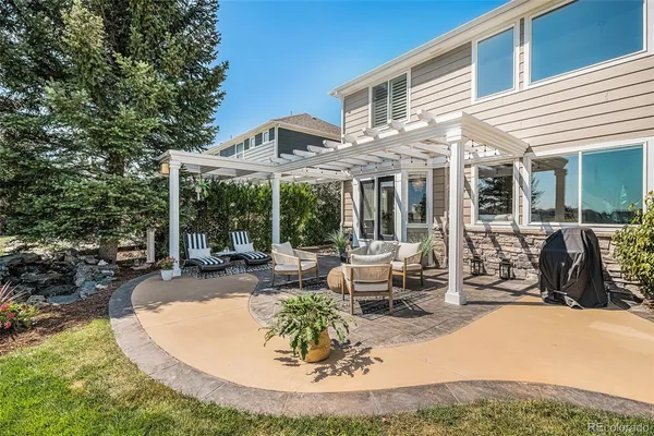 a view of a house with backyard porch and patio
