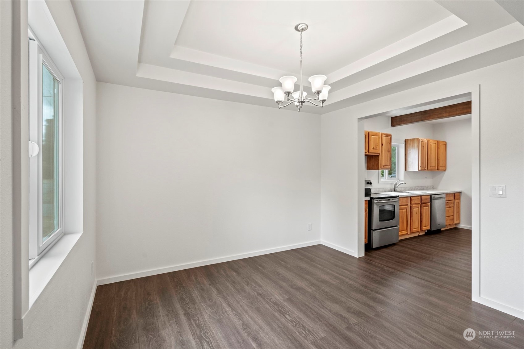 101 Ronge Roy, WA 98580 - Photo 11 of 37 a view of a room with wooden floor and chandelier