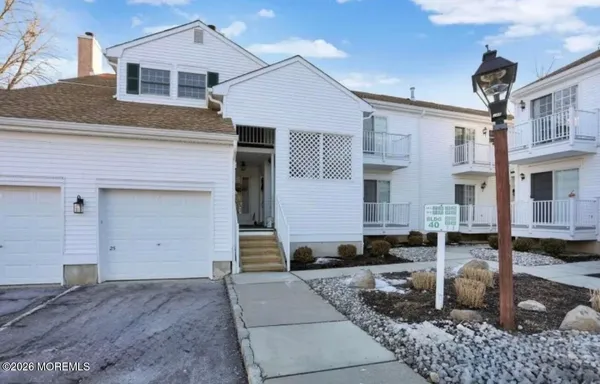 a front view of a house with a garage