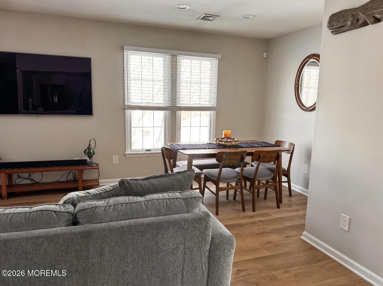 22 Alexandria Way Basking Ridge, NJ 07920 - Photo 16 of 31 a living room with furniture a clock and a window
