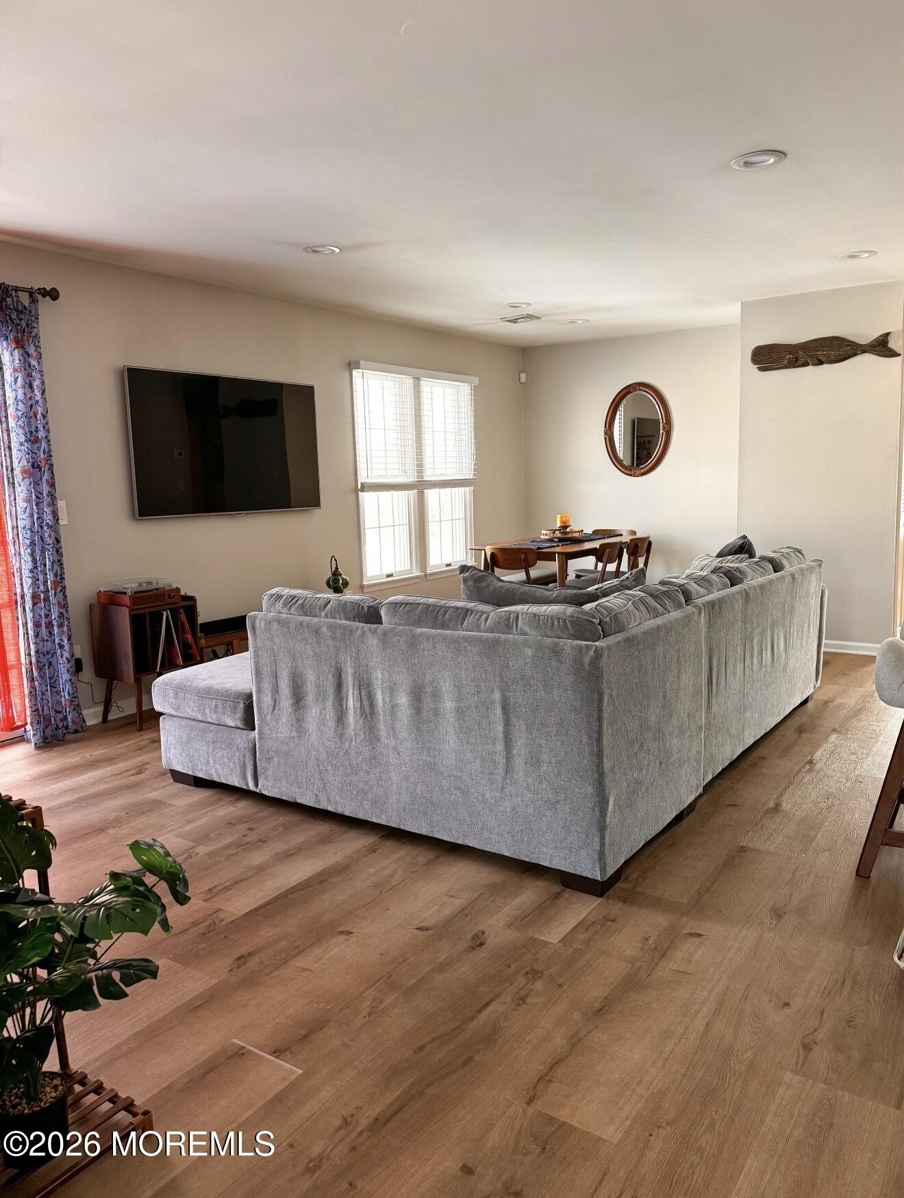 22 Alexandria Way Basking Ridge, NJ 07920 - Photo 17 of 31 a living room with furniture and a flat screen tv