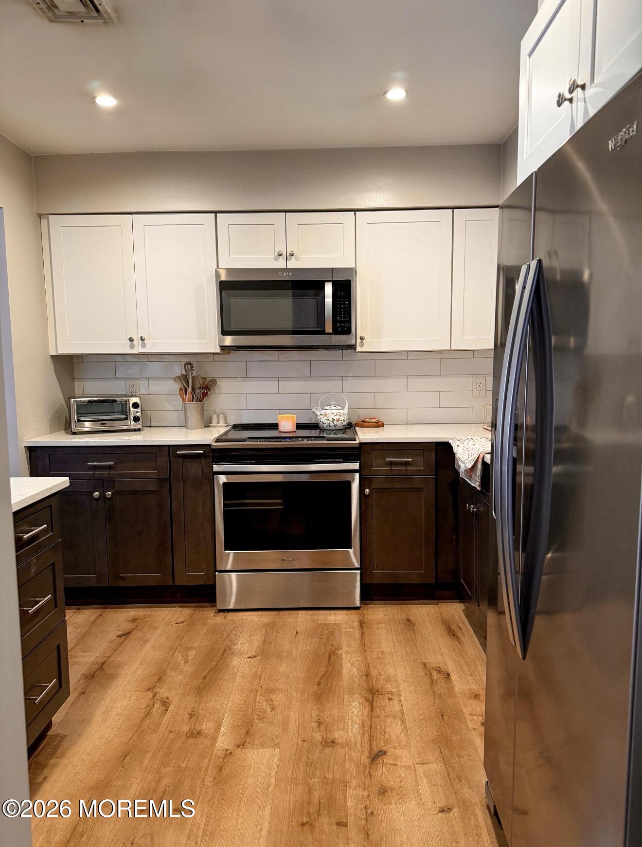 22 Alexandria Way Basking Ridge, NJ 07920 - Photo 9 of 31 a kitchen with stainless steel appliances granite countertop a refrigerator a sink and a stove