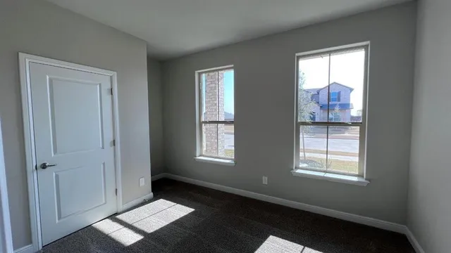 a bathroom with a sink shower and a mirror
