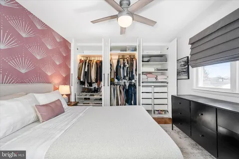 a bedroom with a bed and a walk in closet