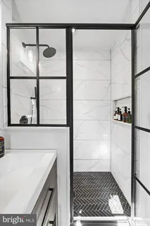 a bathroom with a bathtub and shower