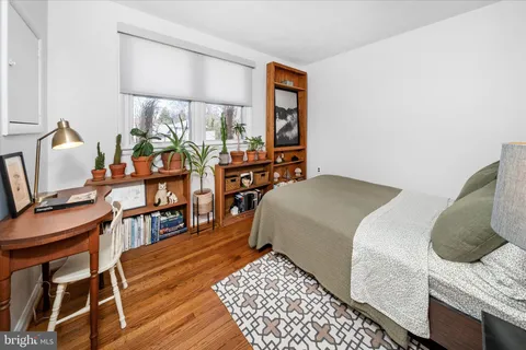 a bedroom with furniture and a window