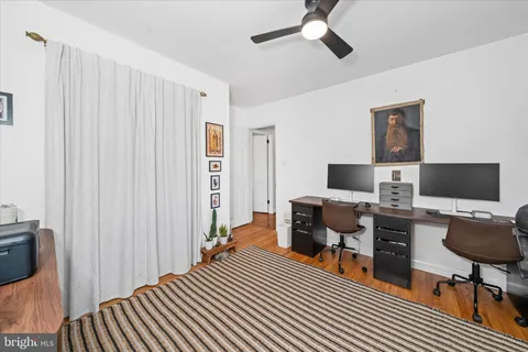 a bedroom with a workspace