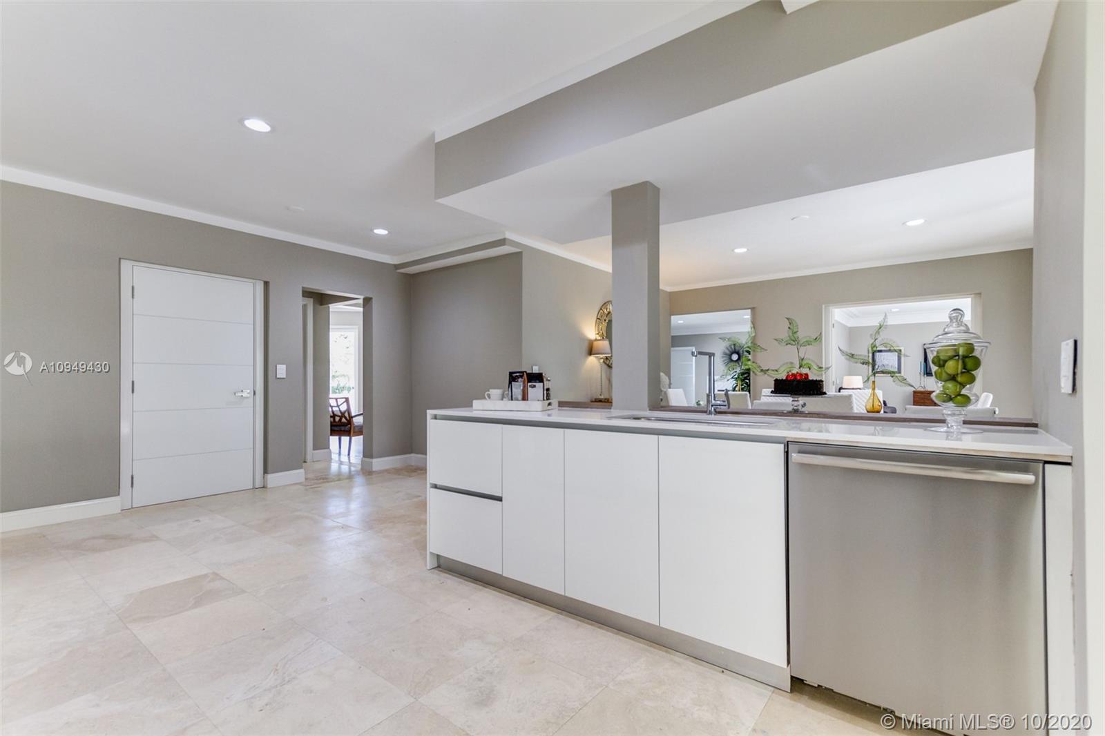 6030 Alton Road Miami Beach, FL 33140 - Photo 11 of 51 a living room with kitchen island granite countertop furniture and a sink