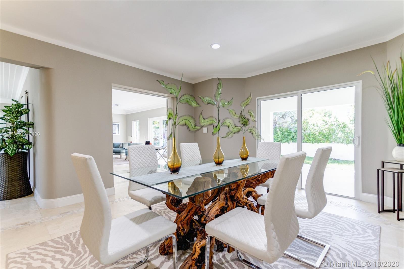 6030 Alton Road Miami Beach, FL 33140 - Photo 12 of 51 a view of a dining room with furniture window and outside view