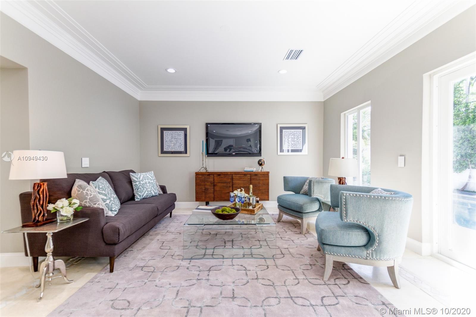 6030 Alton Road Miami Beach, FL 33140 - Photo 14 of 51 a living room with furniture and a couch