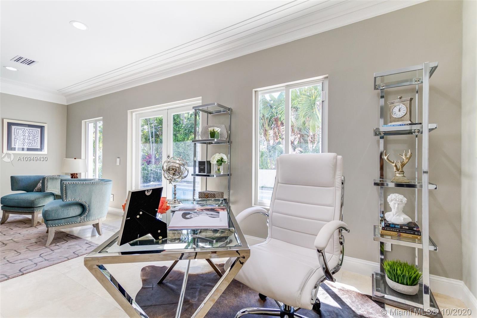6030 Alton Road Miami Beach, FL 33140 - Photo 17 of 51 a living room with furniture and a large window