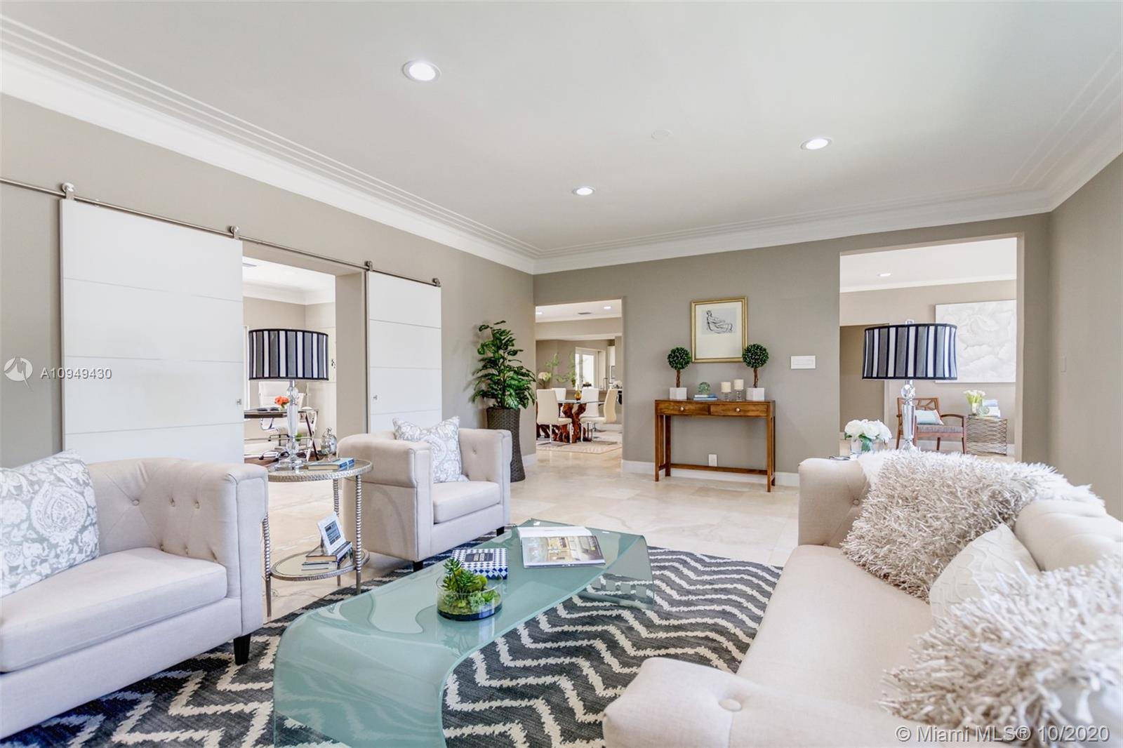 6030 Alton Road Miami Beach, FL 33140 - Photo 20 of 51 a living room with furniture and a wooden floor