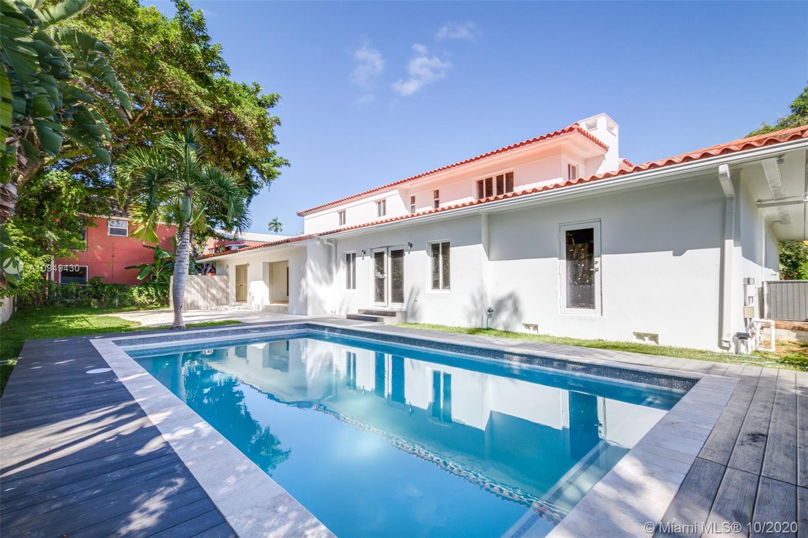 6030 Alton Road Miami Beach, FL 33140 - Photo 3 of 51 a front view of a house with swimming pool
