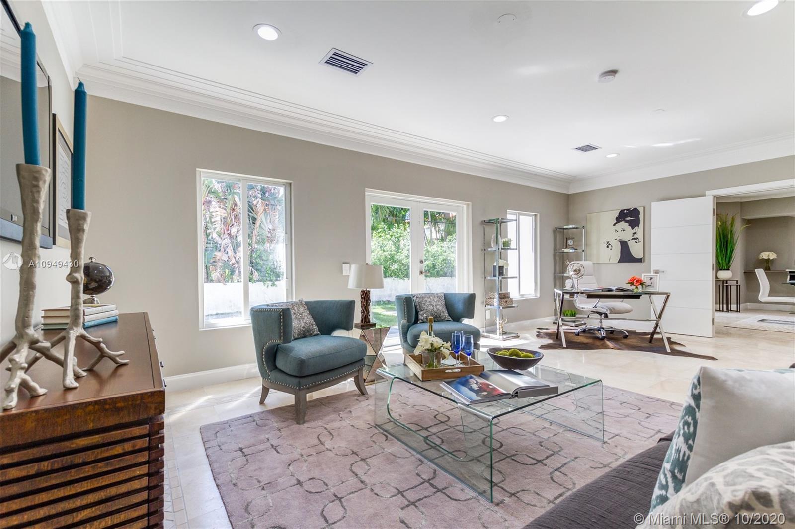 6030 Alton Road Miami Beach, FL 33140 - Photo 21 of 51 a living room with furniture and a large window