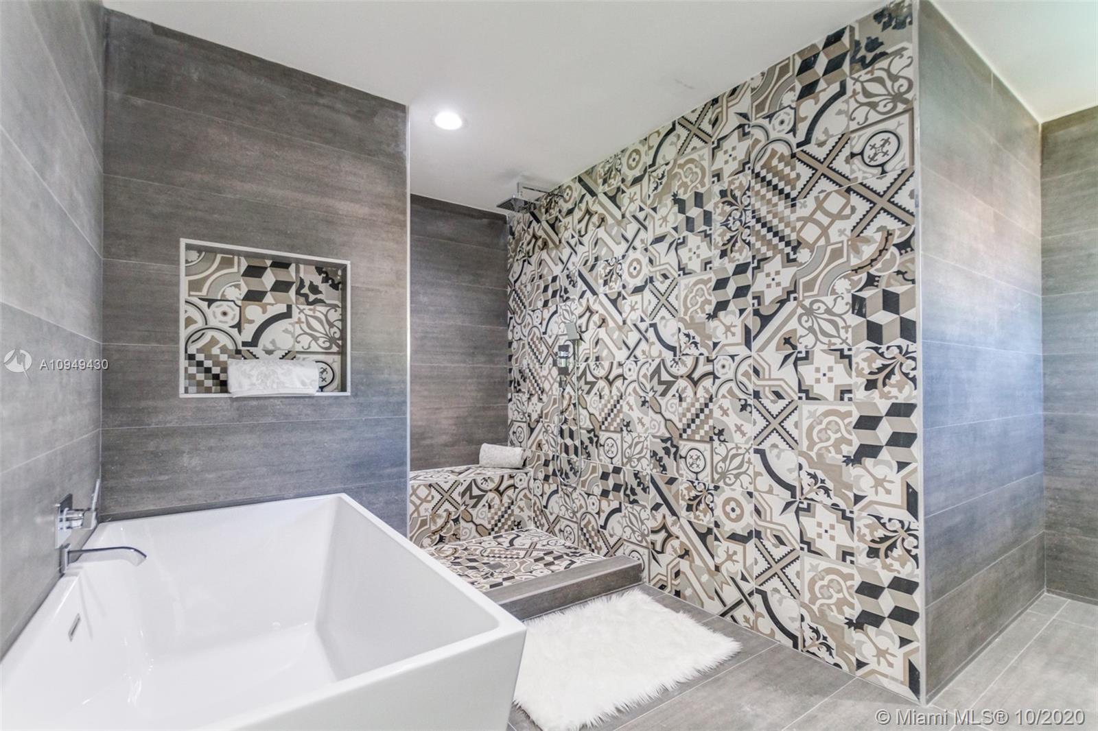6030 Alton Road Miami Beach, FL 33140 - Photo 26 of 51 a bathroom with a bathtub and shower