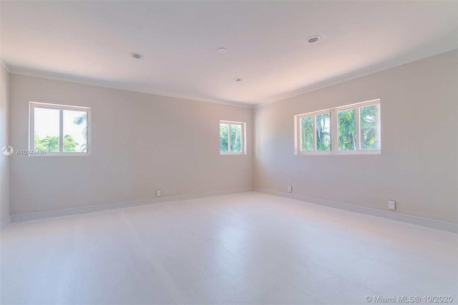 6030 Alton Road Miami Beach, FL 33140 - Photo 30 of 51 an empty room with windows