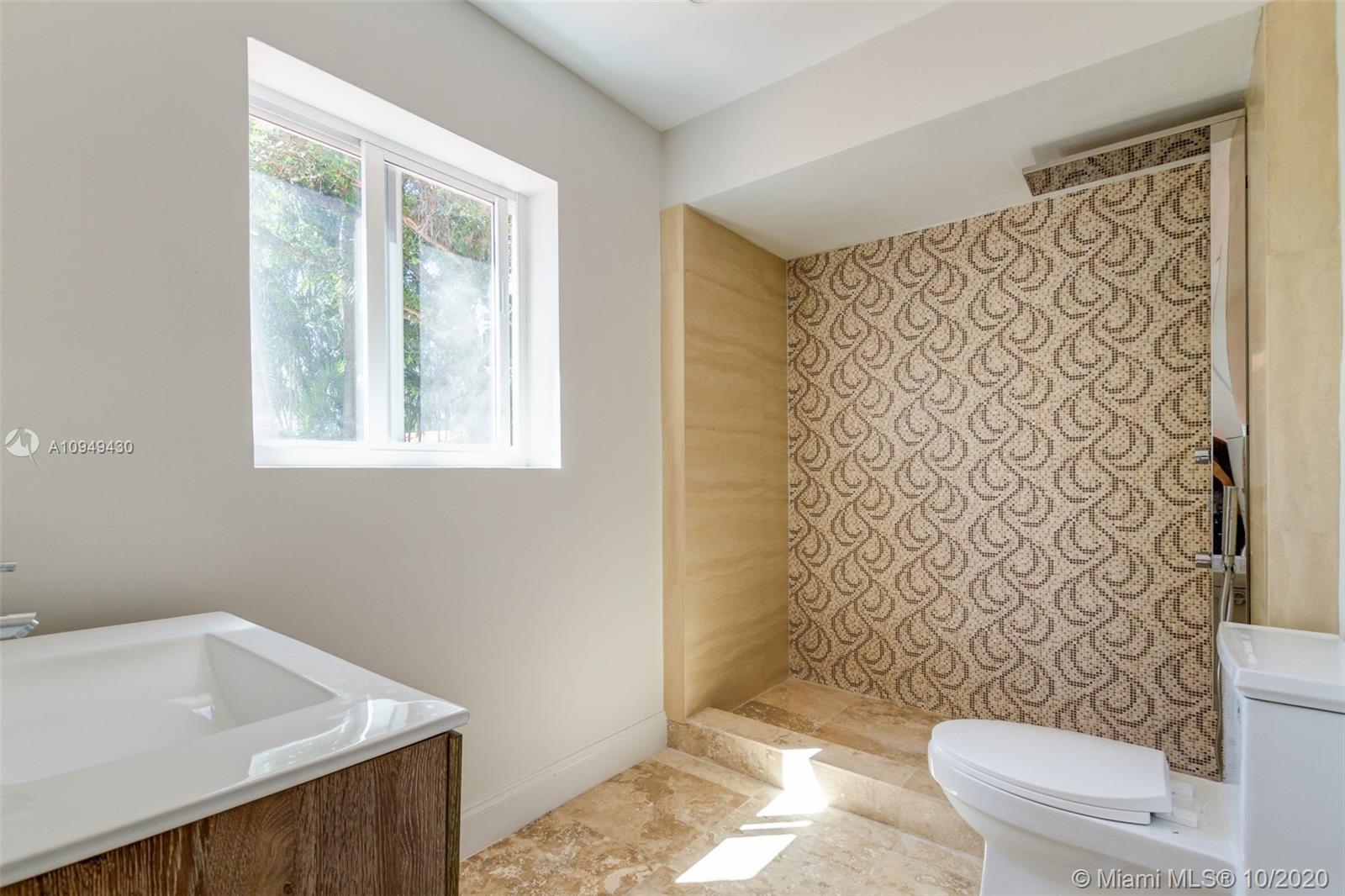 6030 Alton Road Miami Beach, FL 33140 - Photo 32 of 51 a bathroom with a sink toilet and shower