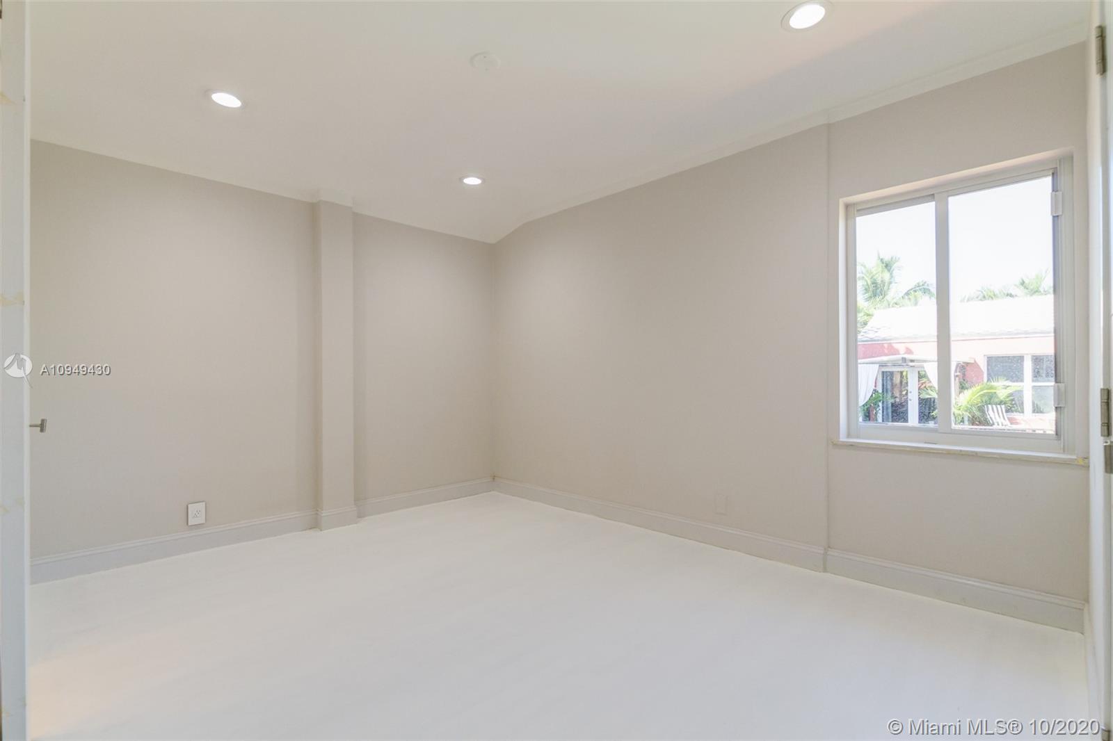 6030 Alton Road Miami Beach, FL 33140 - Photo 34 of 51 a view of an empty room with a window