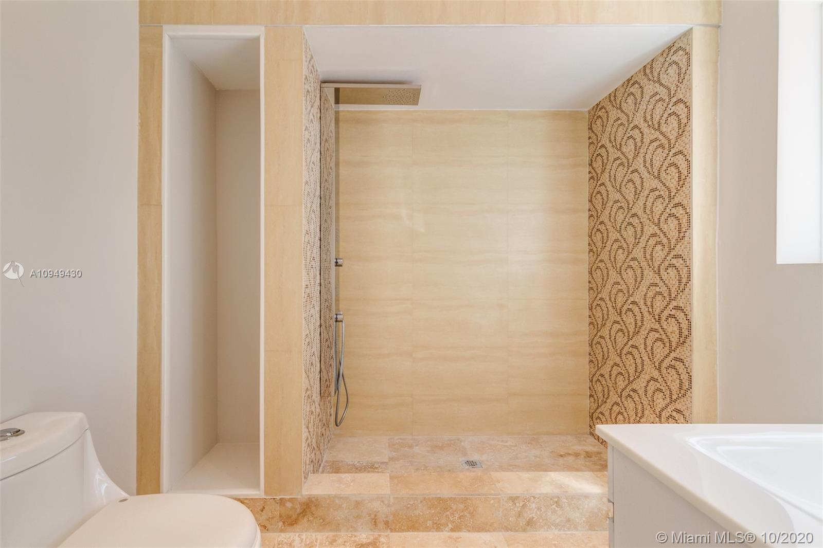 6030 Alton Road Miami Beach, FL 33140 - Photo 36 of 51 a bathroom with a shower and a toilet