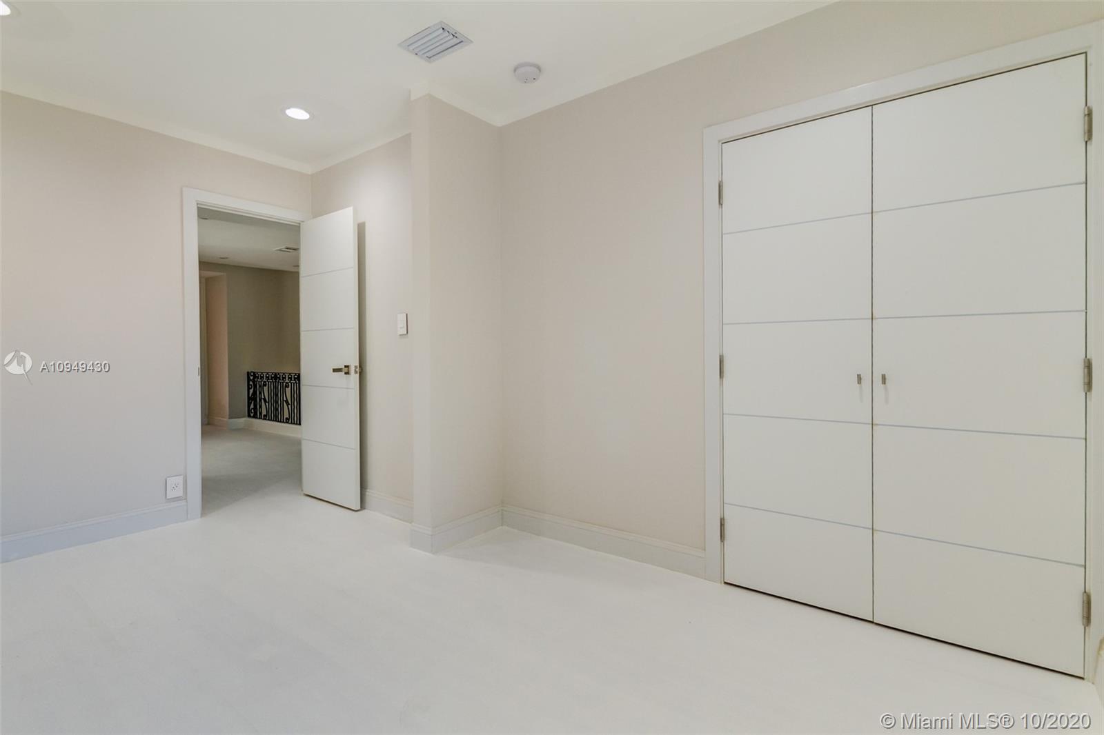 6030 Alton Road Miami Beach, FL 33140 - Photo 40 of 51 an empty room with an entryway