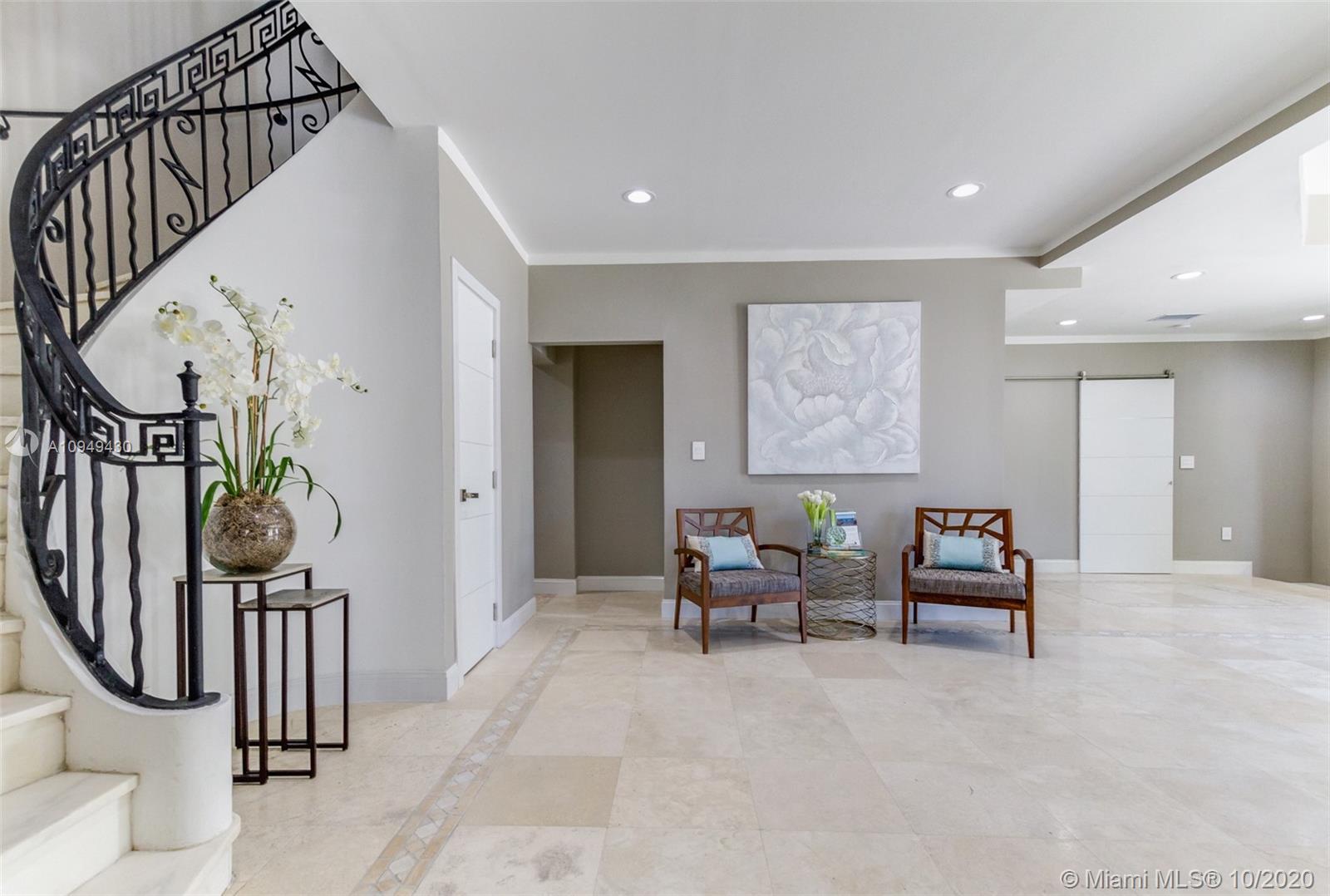 6030 Alton Road Miami Beach, FL 33140 - Photo 5 of 51 a view of a hallway with furniture