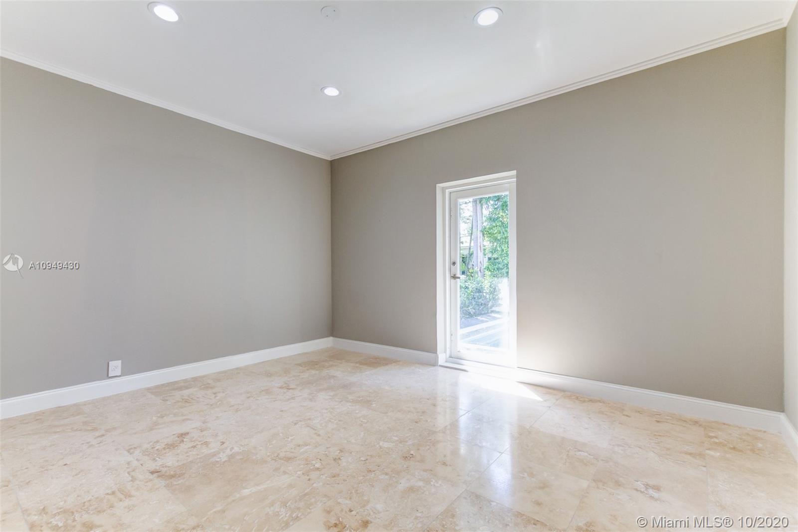 6030 Alton Road Miami Beach, FL 33140 - Photo 42 of 51 an empty room with windows