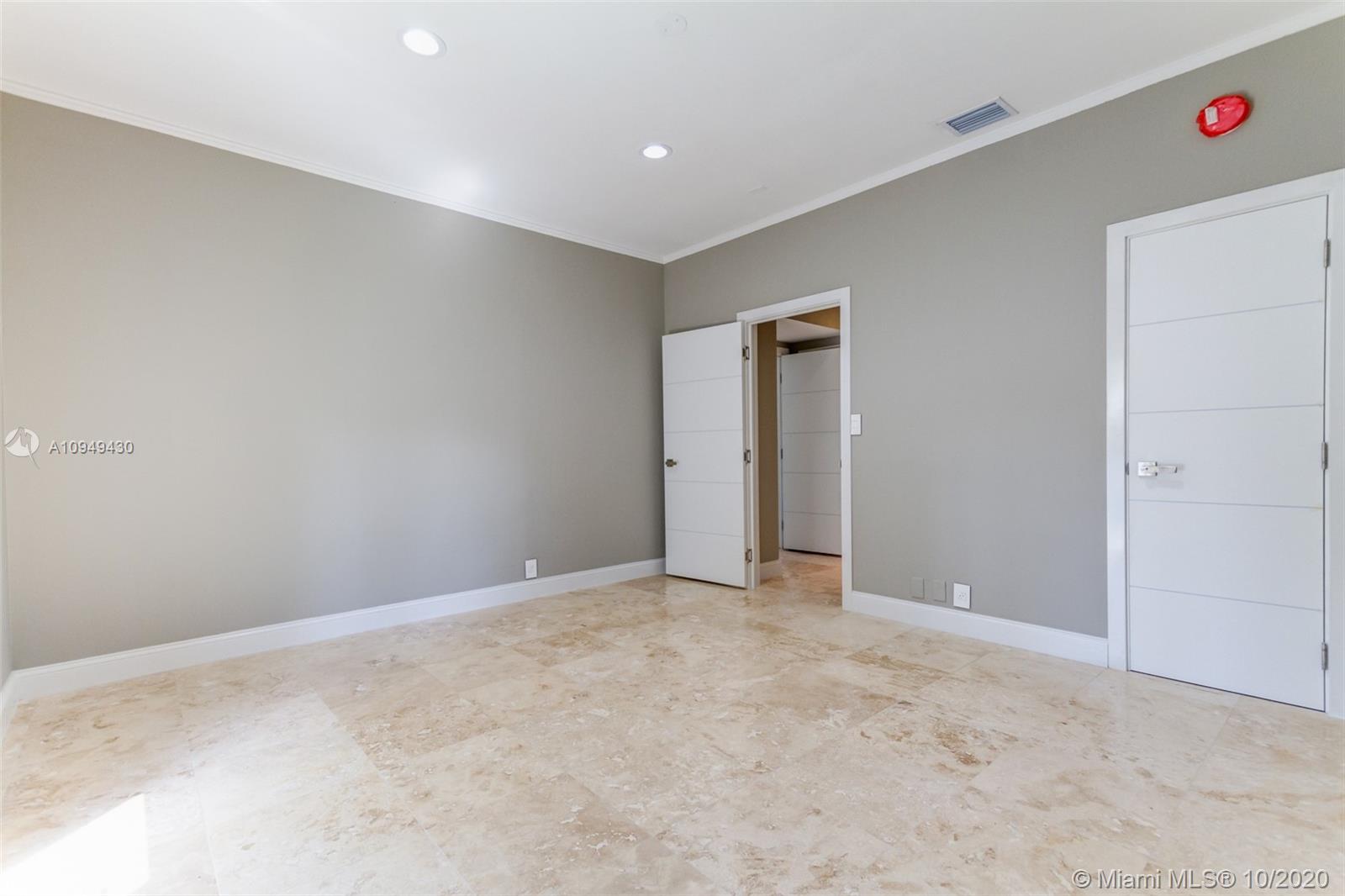 6030 Alton Road Miami Beach, FL 33140 - Photo 43 of 51 an empty room with an entryway