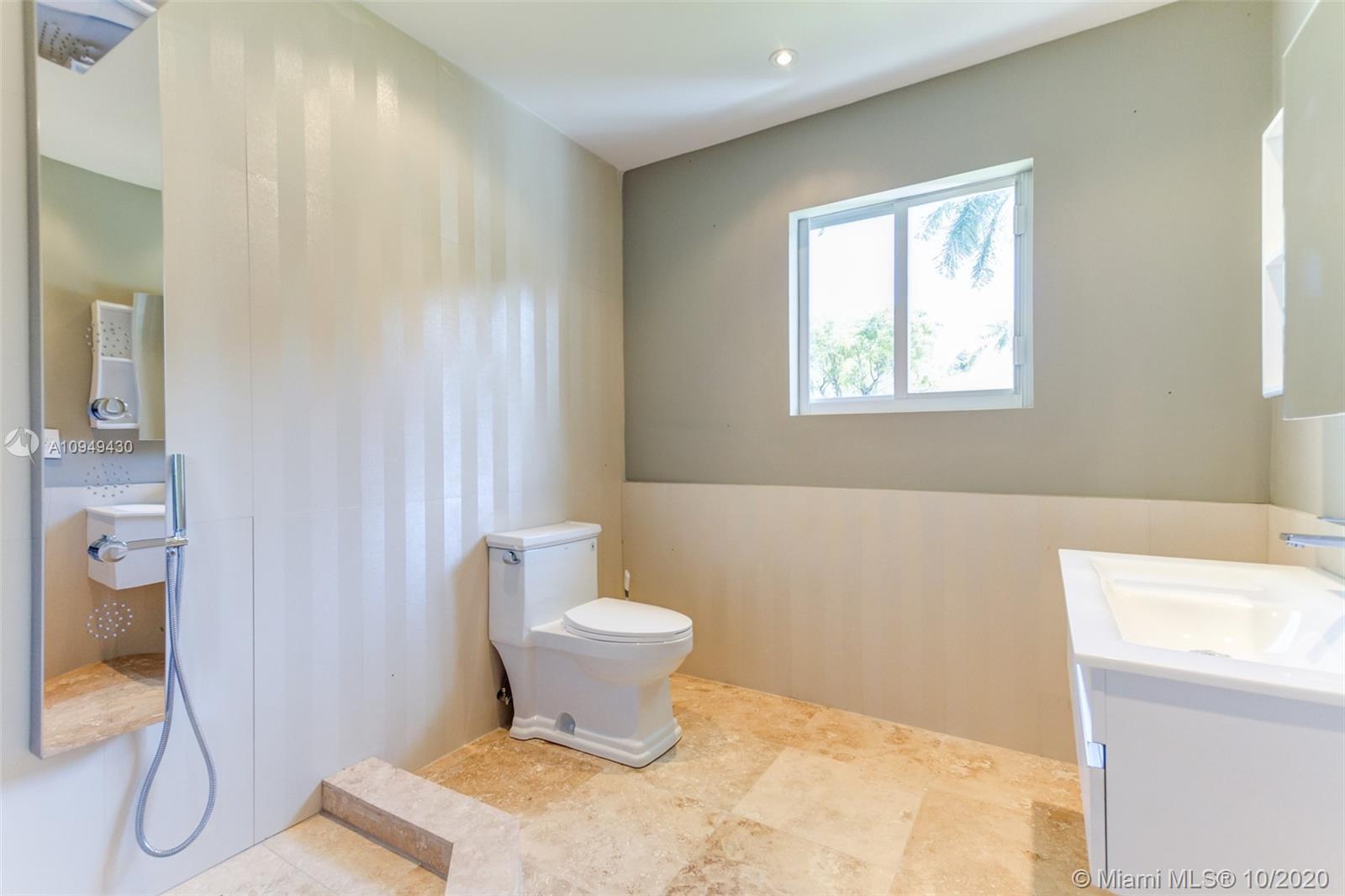 6030 Alton Road Miami Beach, FL 33140 - Photo 44 of 51 a bathroom with a bathtub and shower