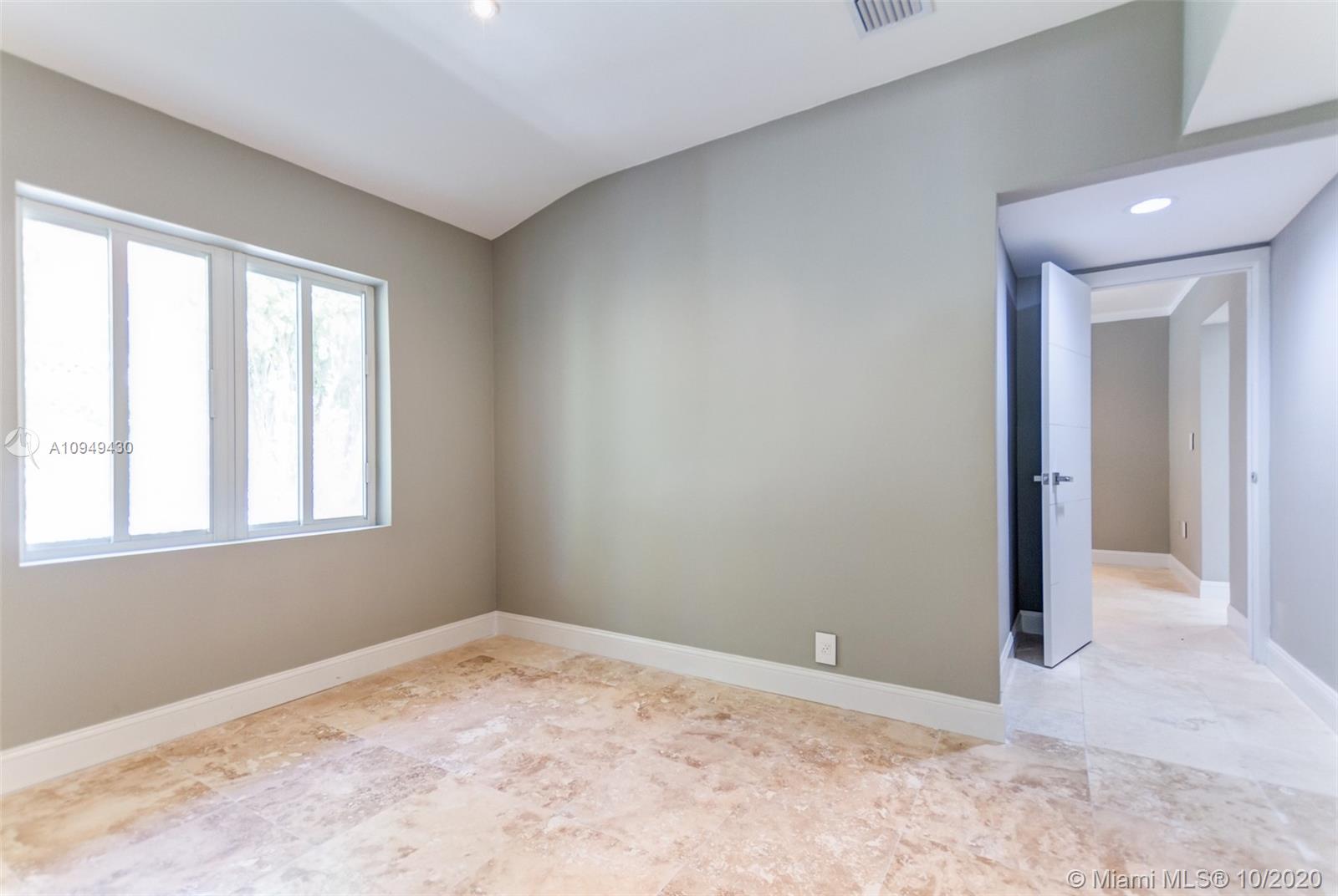 6030 Alton Road Miami Beach, FL 33140 - Photo 48 of 51 an empty room with a window