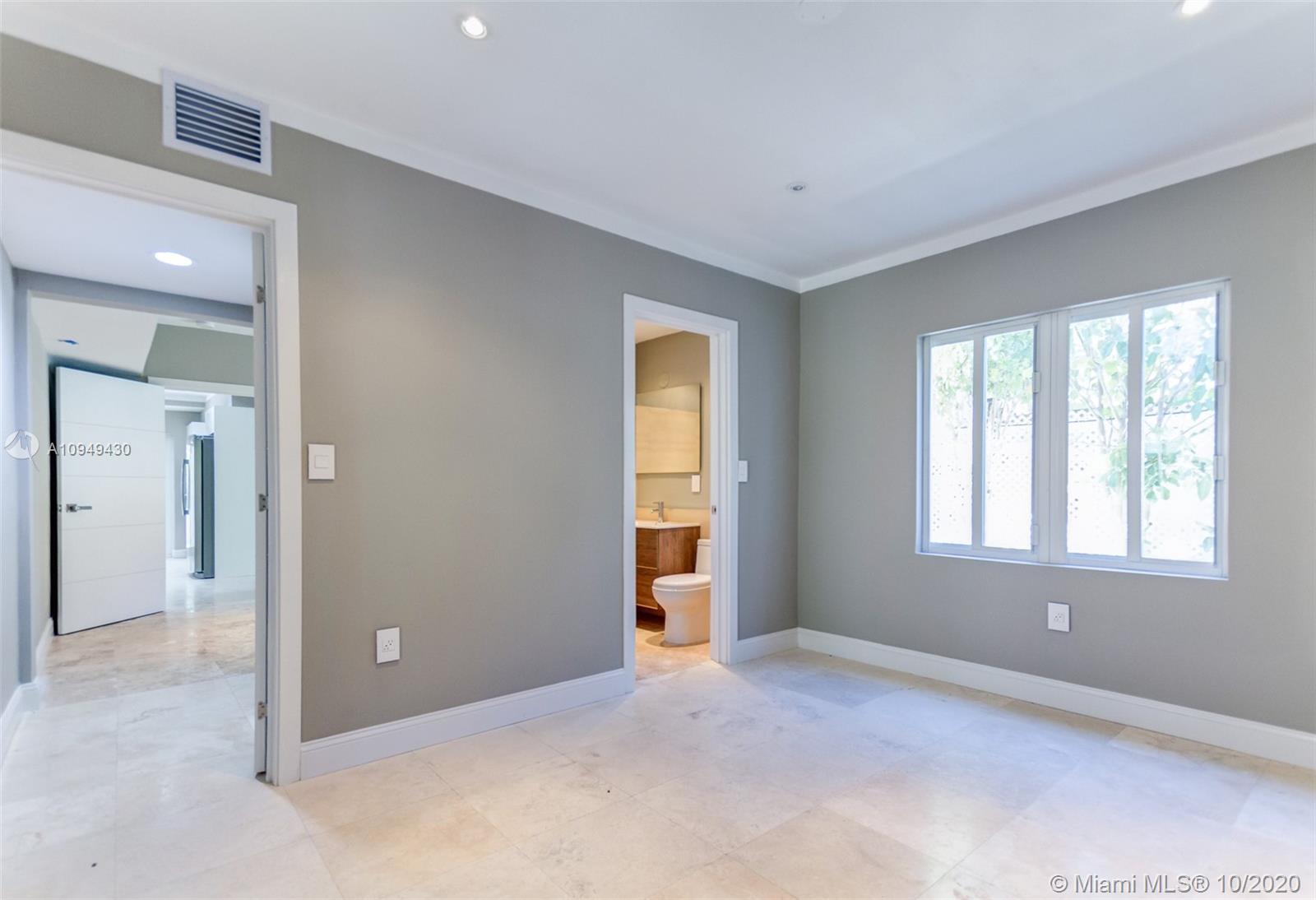 6030 Alton Road Miami Beach, FL 33140 - Photo 50 of 51 an empty room with windows and closet