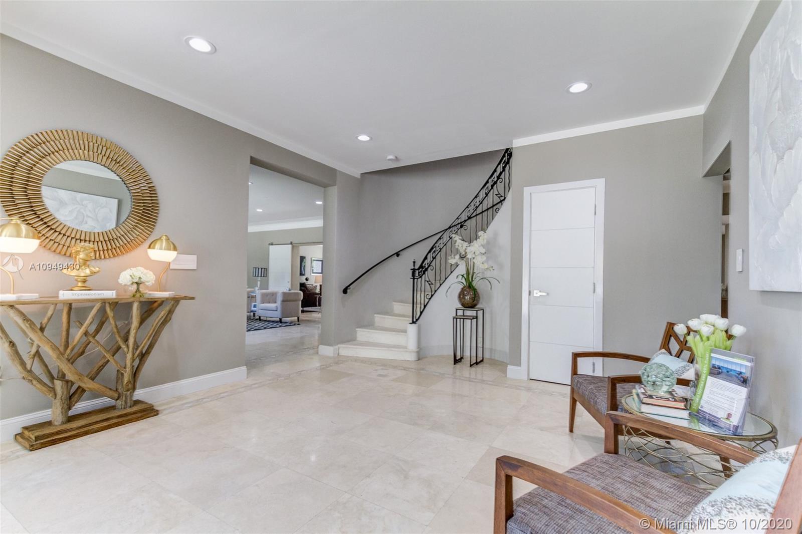 6030 Alton Road Miami Beach, FL 33140 - Photo 6 of 51 a view of a livingroom with furniture and a couch