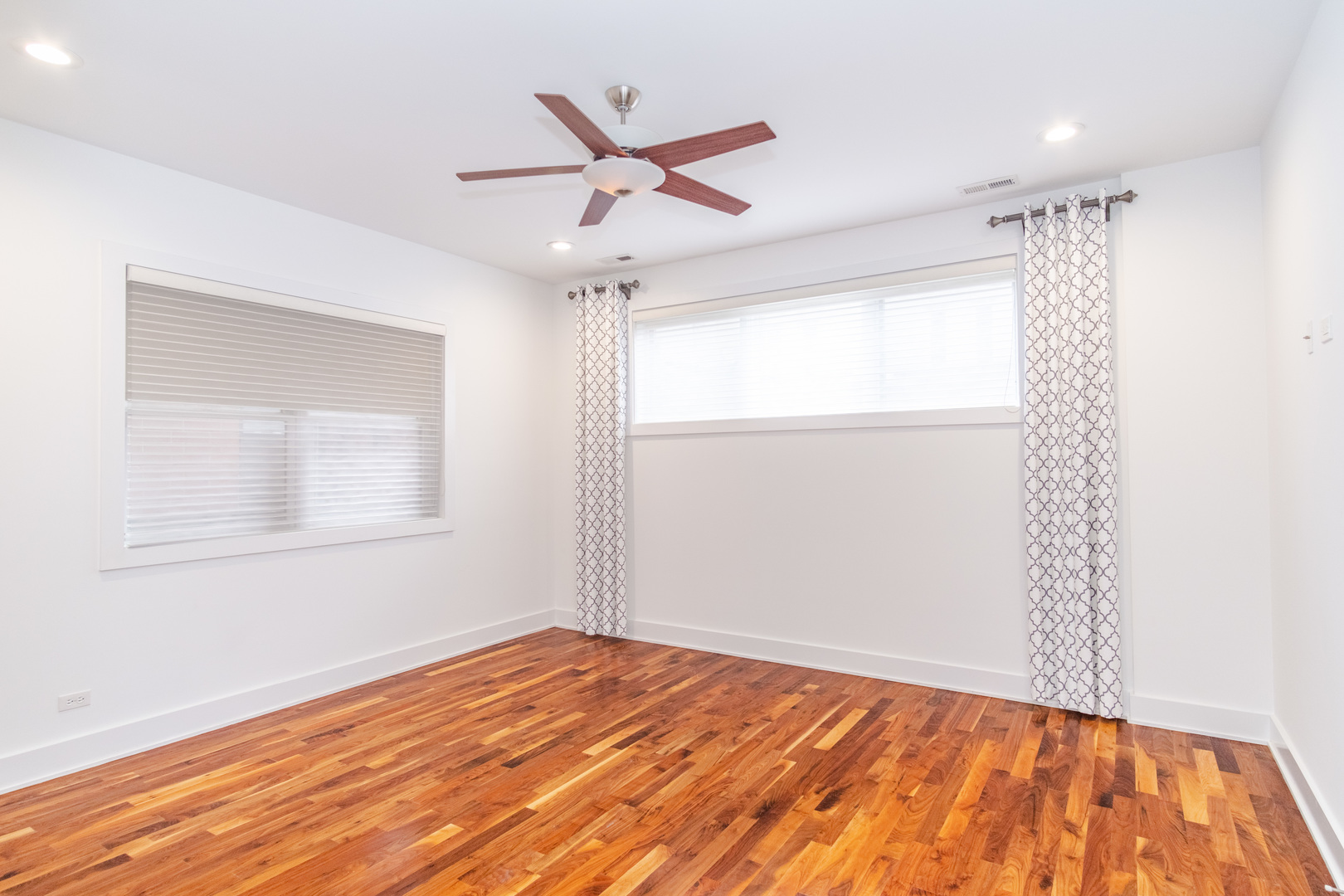 1242 West Jackson Boulevard, Unit 1W Chicago, IL 60607 - Photo 11 of 24 a view of a room with wooden floor and a window