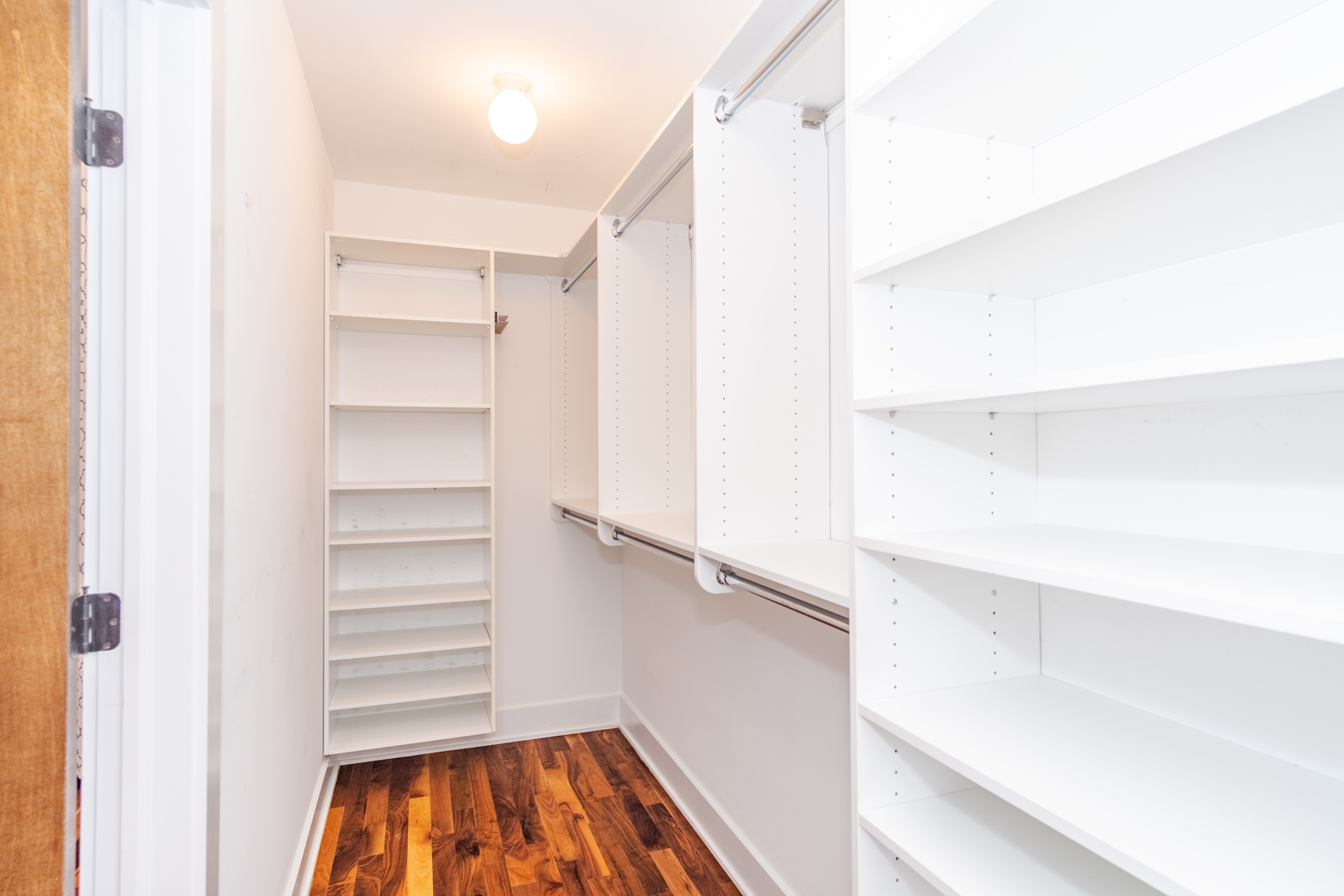 1242 West Jackson Boulevard, Unit 1W Chicago, IL 60607 - Photo 13 of 24 a view of walk in closet with empty racks