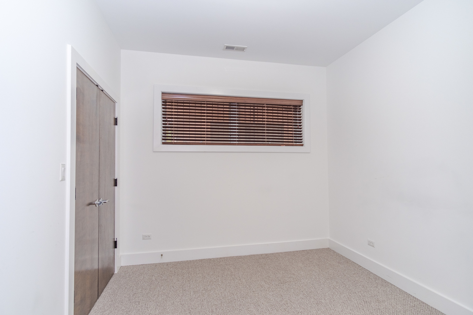 1242 West Jackson Boulevard, Unit 1W Chicago, IL 60607 - Photo 19 of 24 an empty room with a window