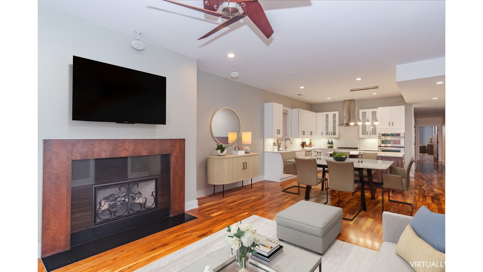 1242 West Jackson Boulevard, Unit 1W Chicago, IL 60607 - Photo 6 of 24 a living room with furniture a fireplace and a flat screen tv