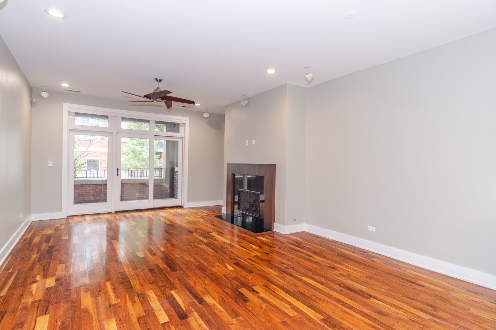 1242 West Jackson Boulevard, Unit 1W Chicago, IL 60607 - Photo 7 of 24 a view of an empty room with wooden floor and a window