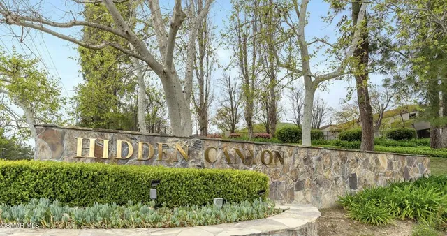 a view of a sign in front of house