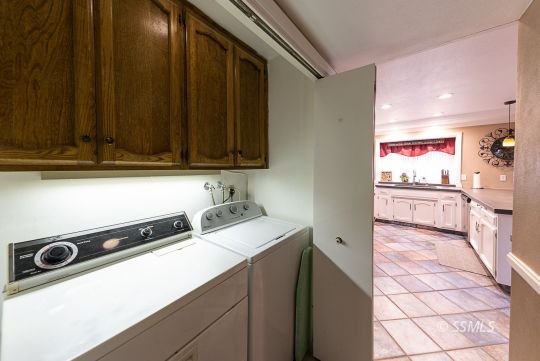 413 South Valley Street Ridgecrest, CA 93555 - Photo 13 of 40 a kitchen that has a microwave a sink and a stove