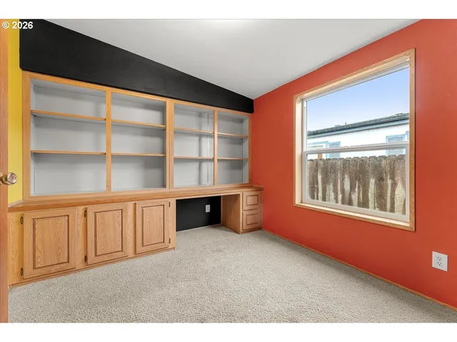 a view of an empty room with a window