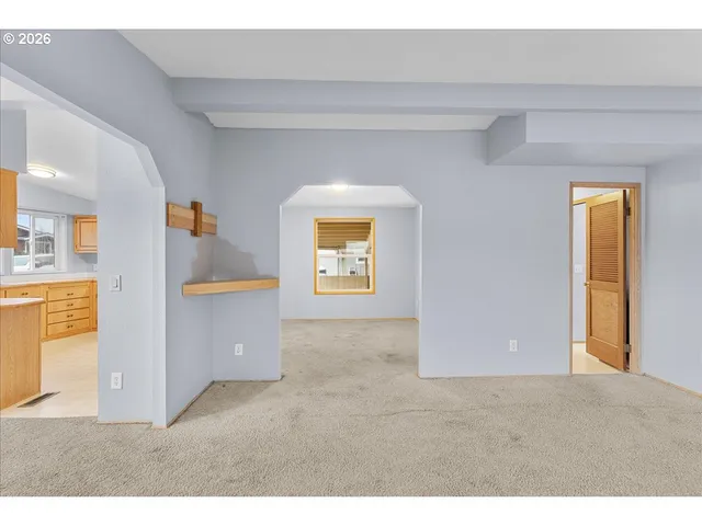 a view of a big room with windows and cabinet