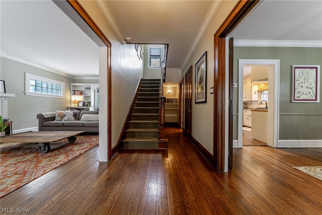 2904 Clarkson Road Cleveland Heights, OH 44118 - Photo 2 of 43 Stairs with crown molding and hardwood / wood-style flooring