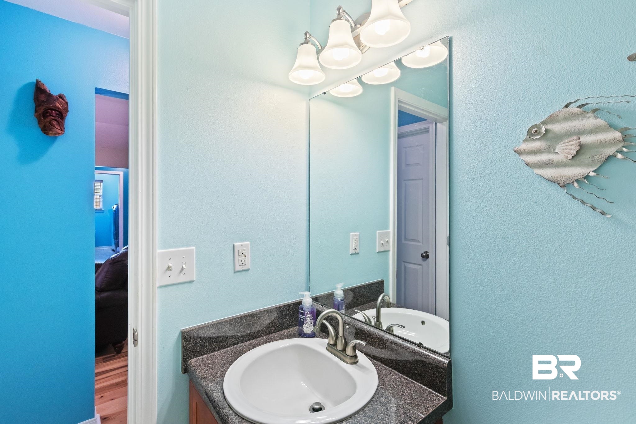 16898 Sugar Loop Foley, AL 36535 - Photo 49 of 67 Bathroom with vanity and wood-type flooring