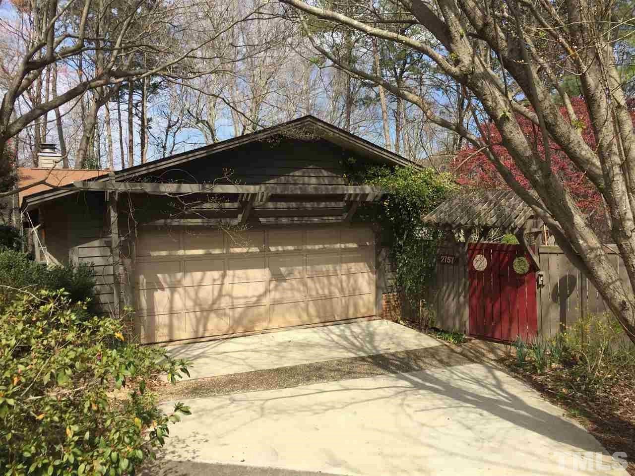 2757 Rue Sans Famille Raleigh, NC 27607 - Photo 2 of 21 a view of a house with a yard