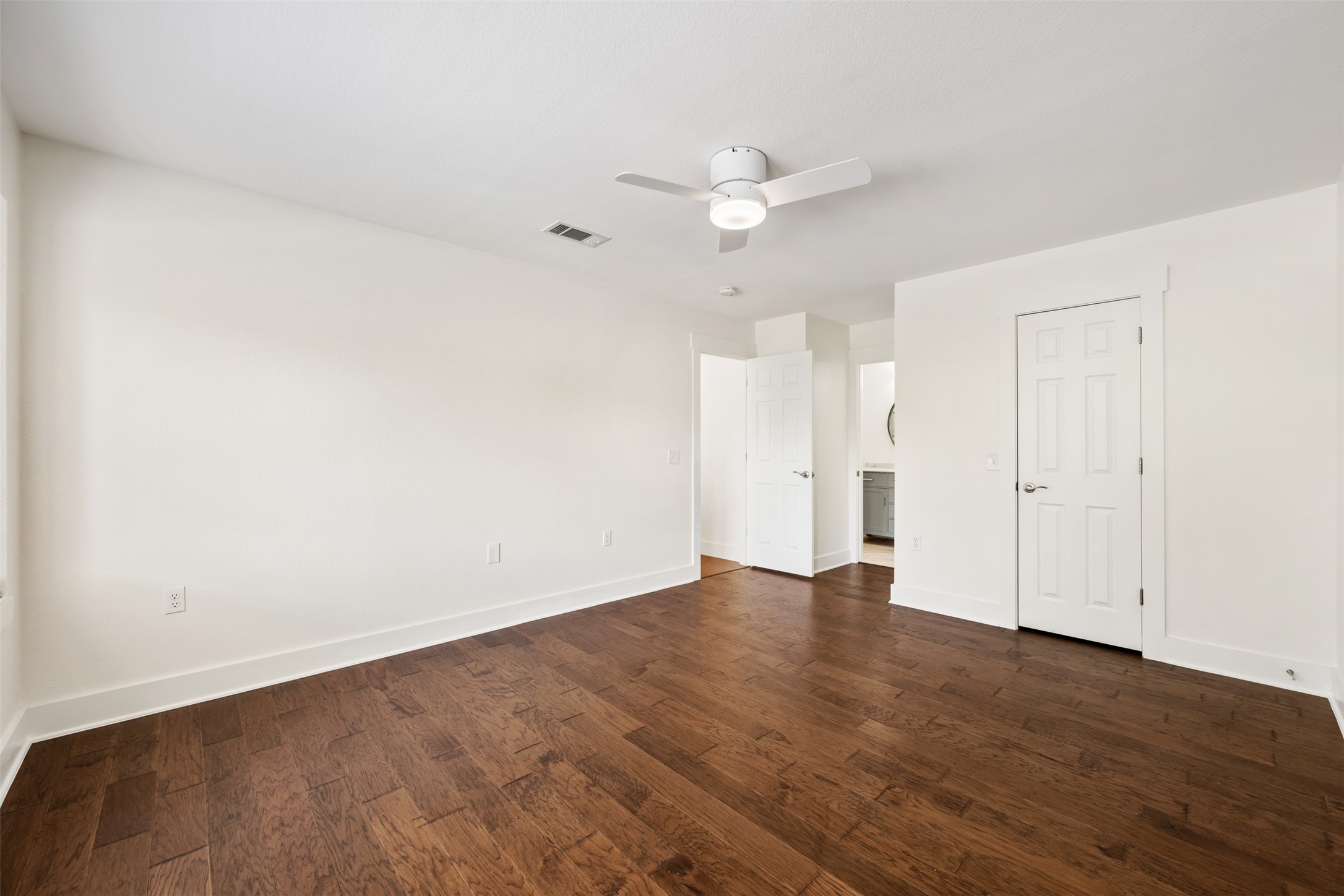 4912 Sara Drive, Unit A Austin, TX 78721 - Photo 19 of 28 Primary bedroom with room for a king-size bed and dresser on opposite wall.